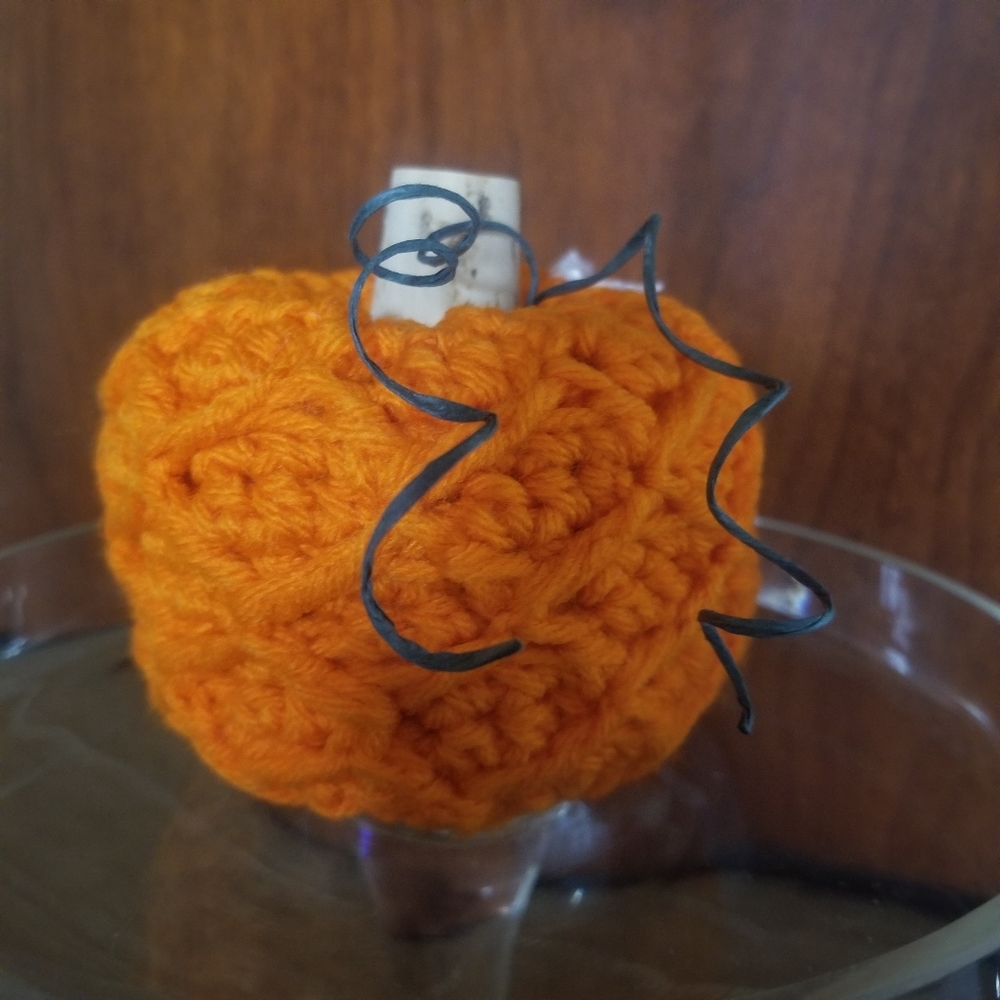 Small orange crocheted pumpkin